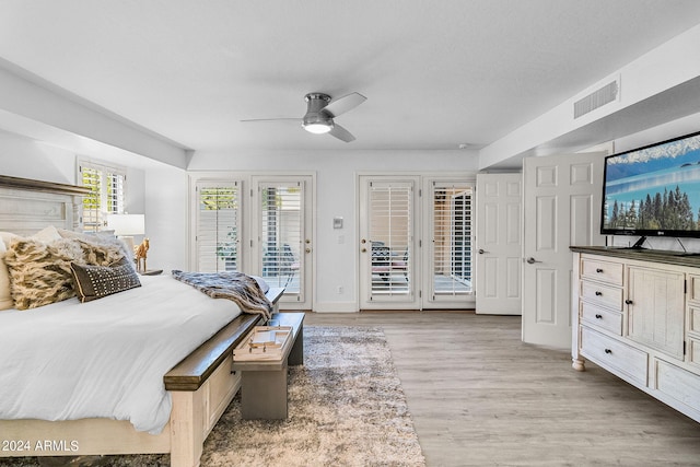 bedroom with access to outside, ceiling fan, and light wood-type flooring