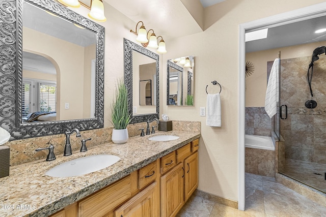 bathroom with separate shower and tub and vanity