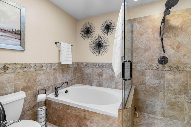 bathroom with shower with separate bathtub and toilet