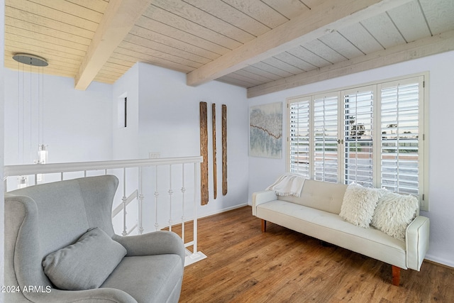 living area with beamed ceiling, wood ceiling, and hardwood / wood-style flooring