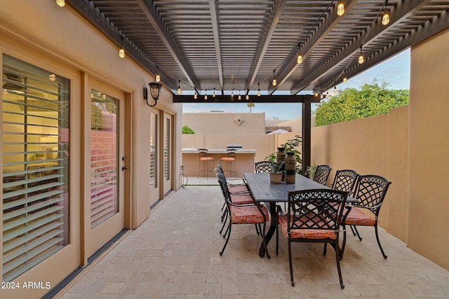 view of patio / terrace featuring an outdoor kitchen and a pergola