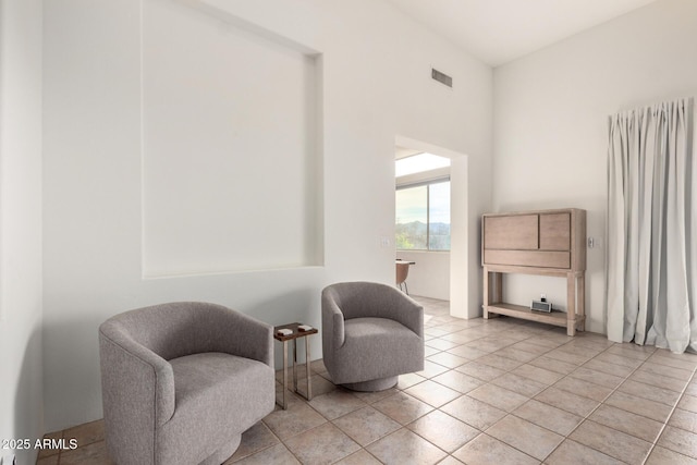 living area featuring light tile patterned flooring