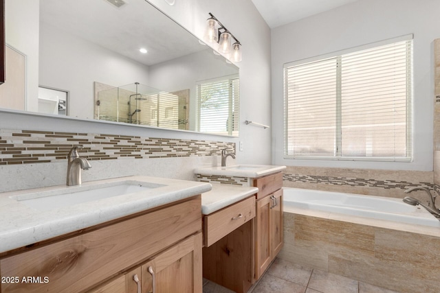 bathroom with tile patterned flooring, vanity, and independent shower and bath