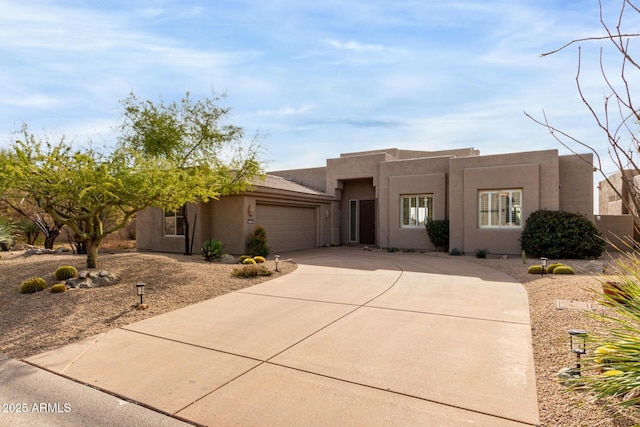 southwest-style home featuring a garage