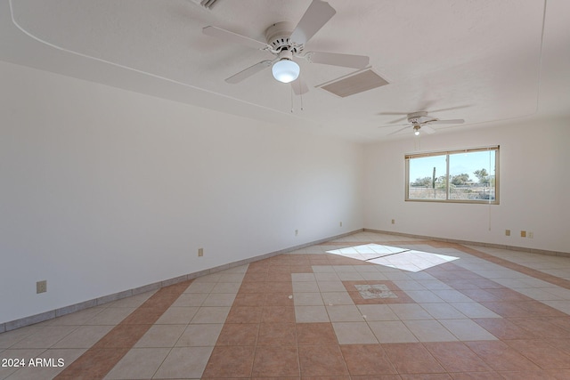 unfurnished room featuring light tile patterned floors and ceiling fan