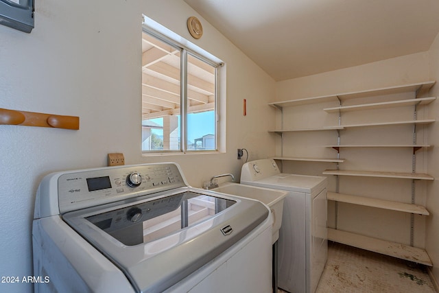 clothes washing area featuring washing machine and clothes dryer