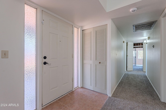 entrance foyer with light tile patterned flooring