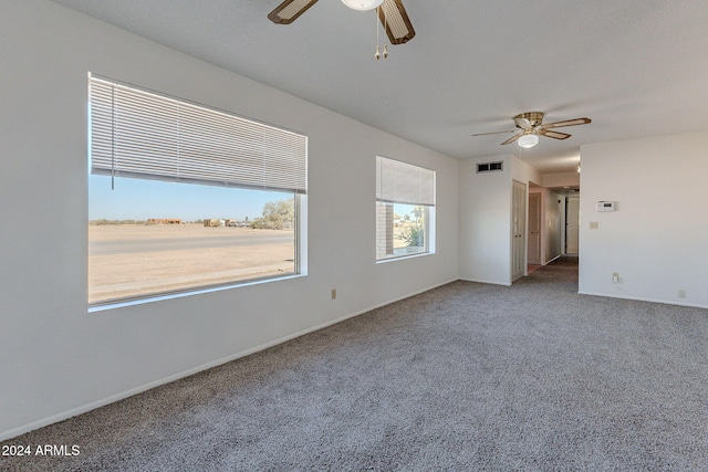 carpeted empty room with ceiling fan