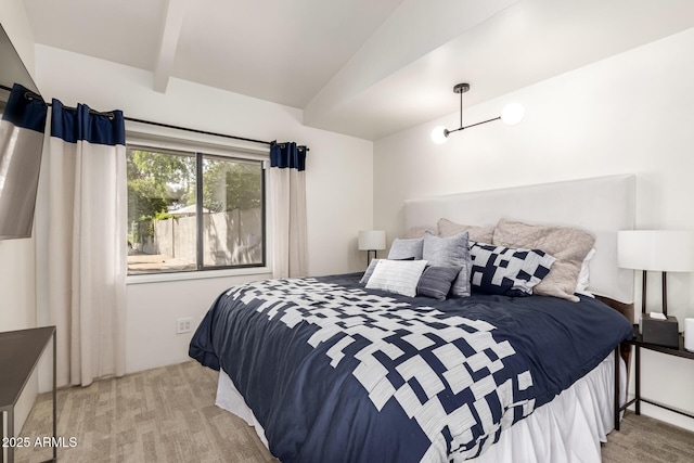 carpeted bedroom featuring vaulted ceiling with beams