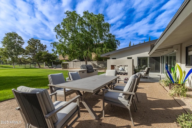 view of patio / terrace featuring outdoor dining area and fence