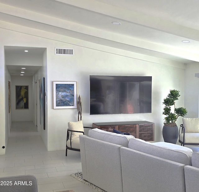 living room featuring visible vents, recessed lighting, and vaulted ceiling