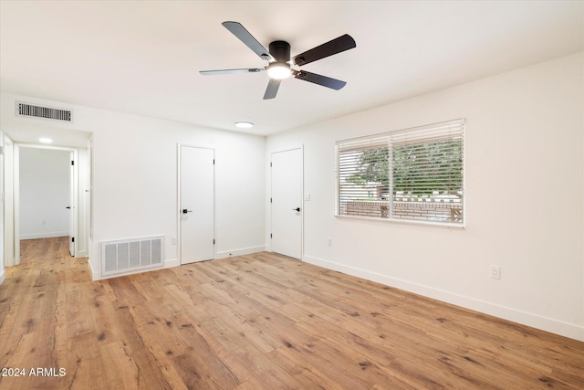 unfurnished bedroom with light hardwood / wood-style floors and ceiling fan