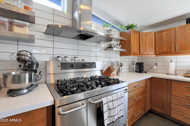 kitchen featuring backsplash, island exhaust hood, and range with two ovens