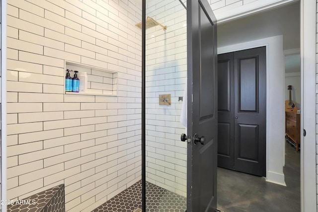 bathroom with a tile shower