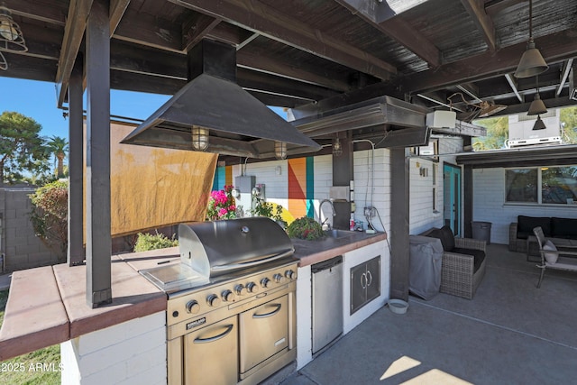 view of patio / terrace with sink and area for grilling