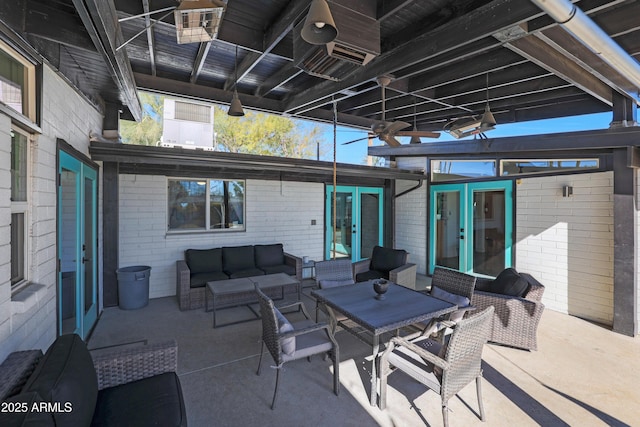 view of patio featuring outdoor lounge area and french doors