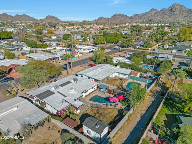 birds eye view of property featuring a mountain view