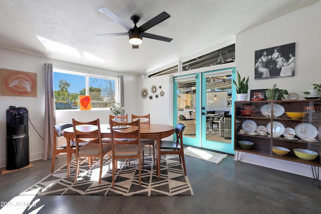 dining space with ceiling fan and lofted ceiling