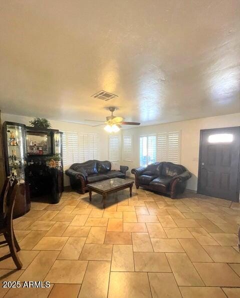 living room featuring ceiling fan