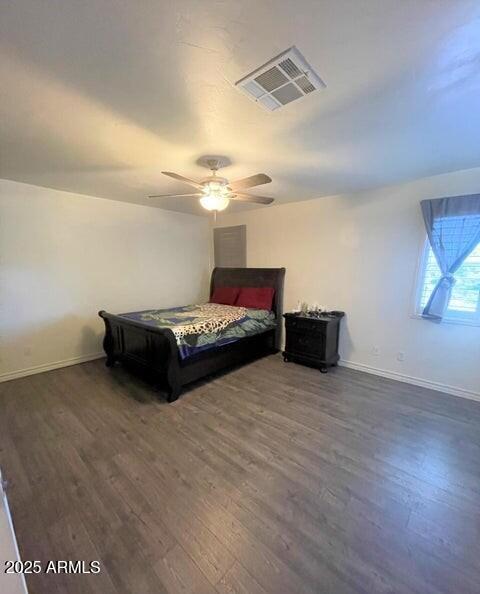 bedroom featuring ceiling fan and dark hardwood / wood-style floors