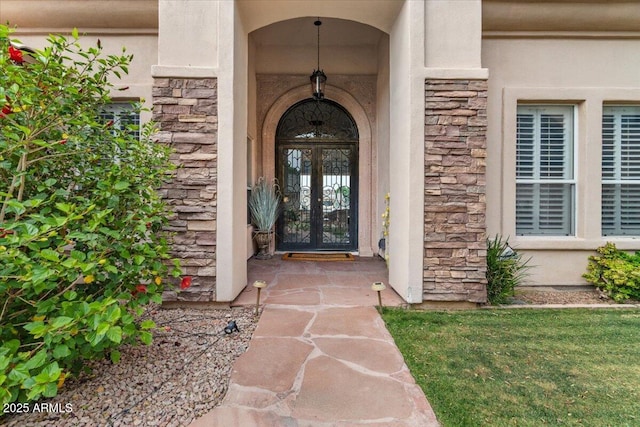 2128 E Clipper Ln, Gilbert, AZ 85234 - view of exterior entry featuring stone siding and stucco siding