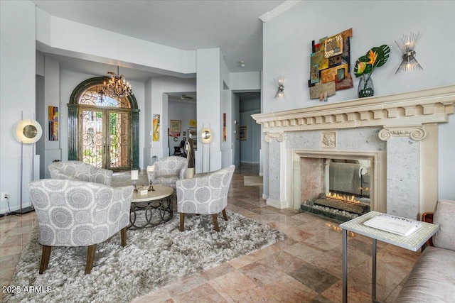 2128 E Clipper Ln, Gilbert, AZ 85234 - living room featuring a premium fireplace and a chandelier