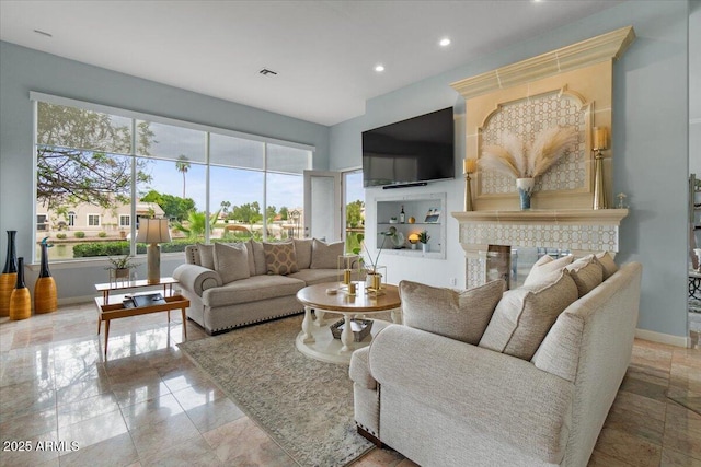 2128 E Clipper Ln, Gilbert, AZ 85234 - living room featuring baseboards, recessed lighting, and a glass covered fireplace