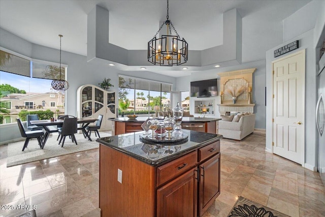 2128 E Clipper Ln, Gilbert, AZ 85234 - kitchen with a chandelier, a center island, open floor plan, decorative light fixtures, and recessed lighting