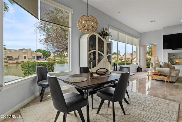 2128 E Clipper Ln, Gilbert, AZ 85234 - sunroom / solarium with healthy amount of natural light and a chandelier