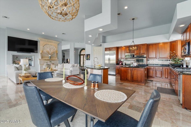 2128 E Clipper Ln, Gilbert, AZ 85234 - dining area with a chandelier, recessed lighting, and light marble finish flooring