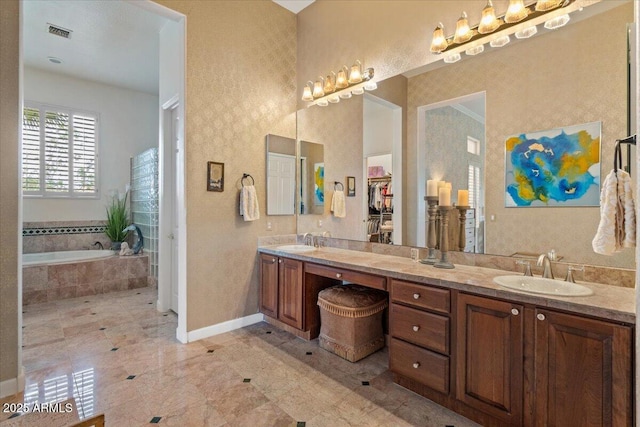 2128 E Clipper Ln, Gilbert, AZ 85234 - full bathroom featuring double vanity, baseboards, and a bath