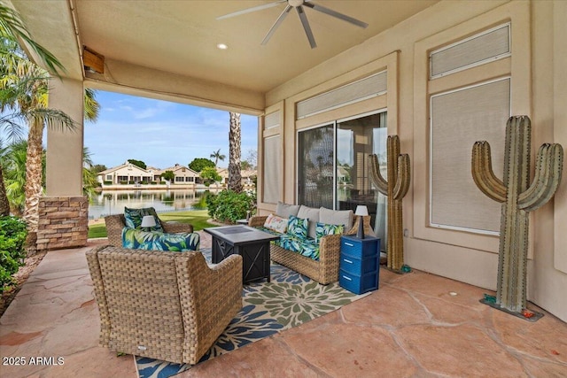 2128 E Clipper Ln, Gilbert, AZ 85234 - view of patio with ceiling fan, a water view, and an outdoor living space with a fire pit