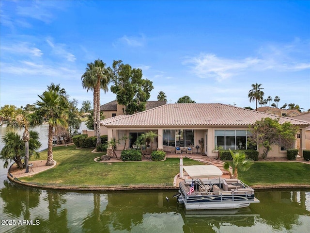 2128 E Clipper Ln, Gilbert, AZ 85234 - back of property with a tiled roof, a water view, a yard, and stucco siding