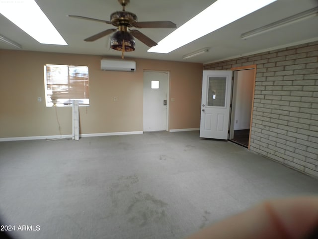 garage featuring a wall mounted AC and ceiling fan