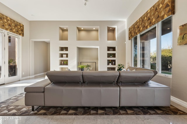 living room featuring built in shelves