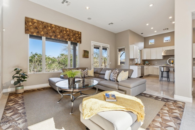 living room featuring a high ceiling