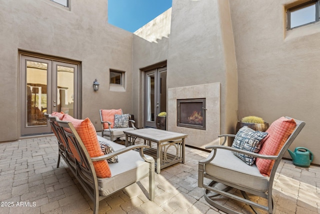 view of patio / terrace featuring a tile fireplace