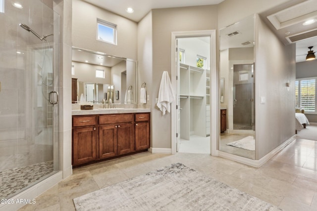 bathroom with vanity, tile patterned floors, and walk in shower