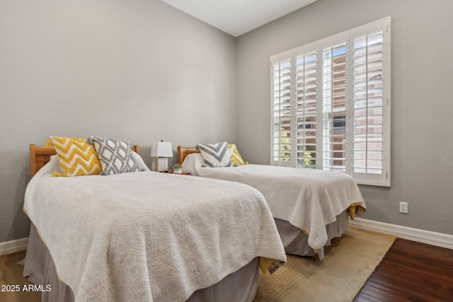 bedroom with hardwood / wood-style floors