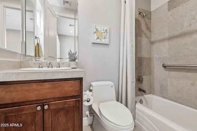 full bathroom with shower / tub combo with curtain, vanity, and toilet