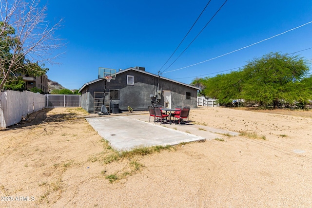 511 E Purdue Ave, Phoenix, AZ 85020 - rear view of property featuring stucco siding and a patio