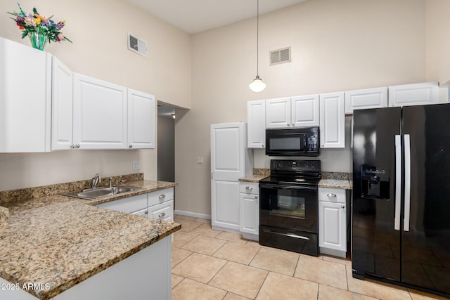 511 E Purdue Ave, Phoenix, AZ 85020 - kitchen featuring black appliances, a sink, a high ceiling, white cabinets, and hanging light fixtures