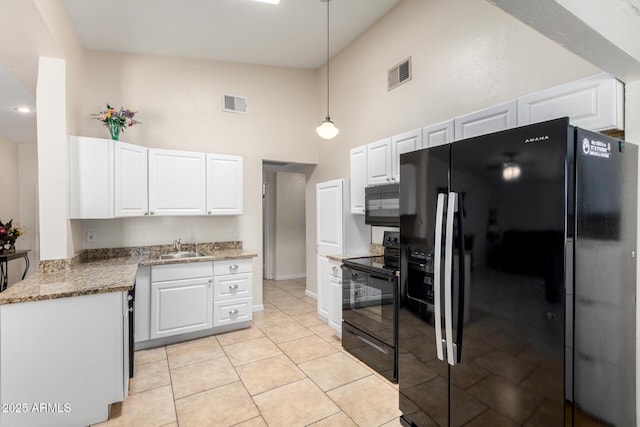 511 E Purdue Ave, Phoenix, AZ 85020 - kitchen featuring black appliances, a high ceiling, a sink, white cabinetry, and decorative light fixtures