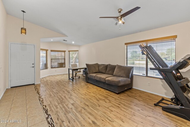 living room featuring wood-type flooring, vaulted ceiling, and ceiling fan