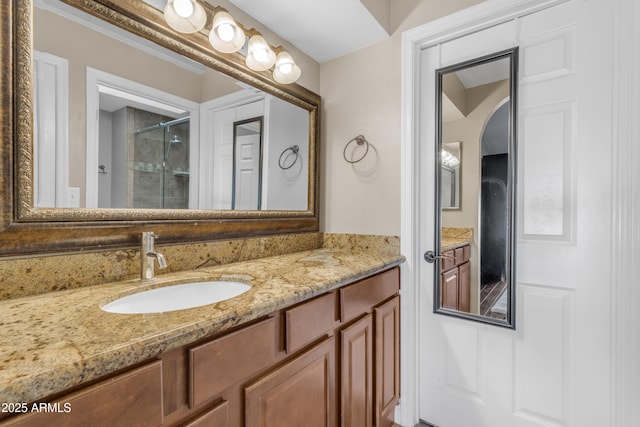full bathroom featuring vanity and a stall shower