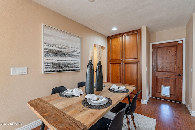 dining room with dark wood-type flooring, recessed lighting, visible vents, and baseboards