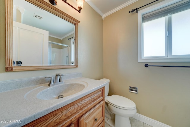 bathroom with tile patterned flooring, vanity, toilet, and ornamental molding