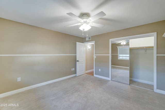 unfurnished bedroom with ceiling fan and a closet