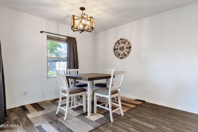 4595 W Foldwing Dr, San Tan Valley, AZ 85144 - dining area featuring a chandelier, wood finished floors, and baseboards