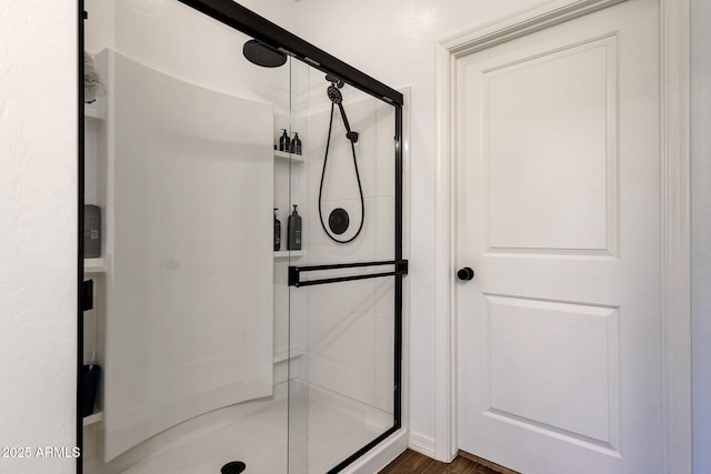 4595 W Foldwing Dr, San Tan Valley, AZ 85144 - full bathroom with a stall shower and wood finished floors